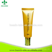 Tube de crème de haute qualité d&#39;oeil avec le tube cosmétique en plastique de chapeau brillant d&#39;or